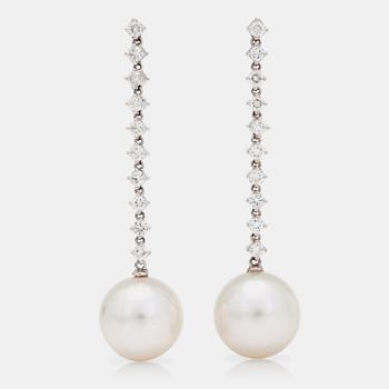 1214. A pair of cultured South Sea pearls and brilliant-cut diamond earrings. Total gem-weight circa 1.20ct.