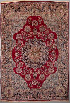 A CARPET, , semi-antique Kerman, ca 431 x 296 cm.