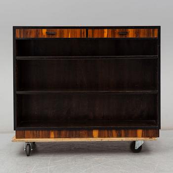 a 1930's stained birch bookshelf.