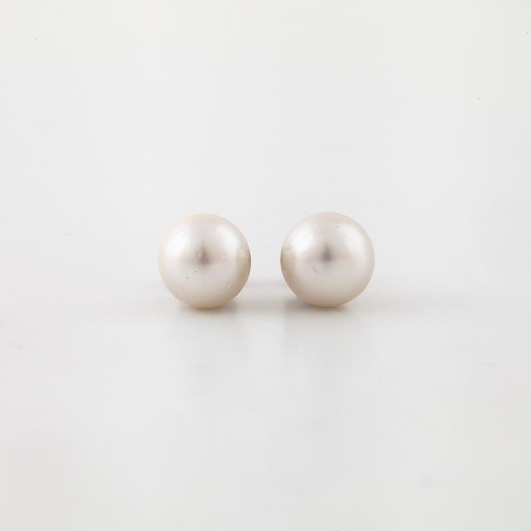 A pair of cultured pearl earrings.