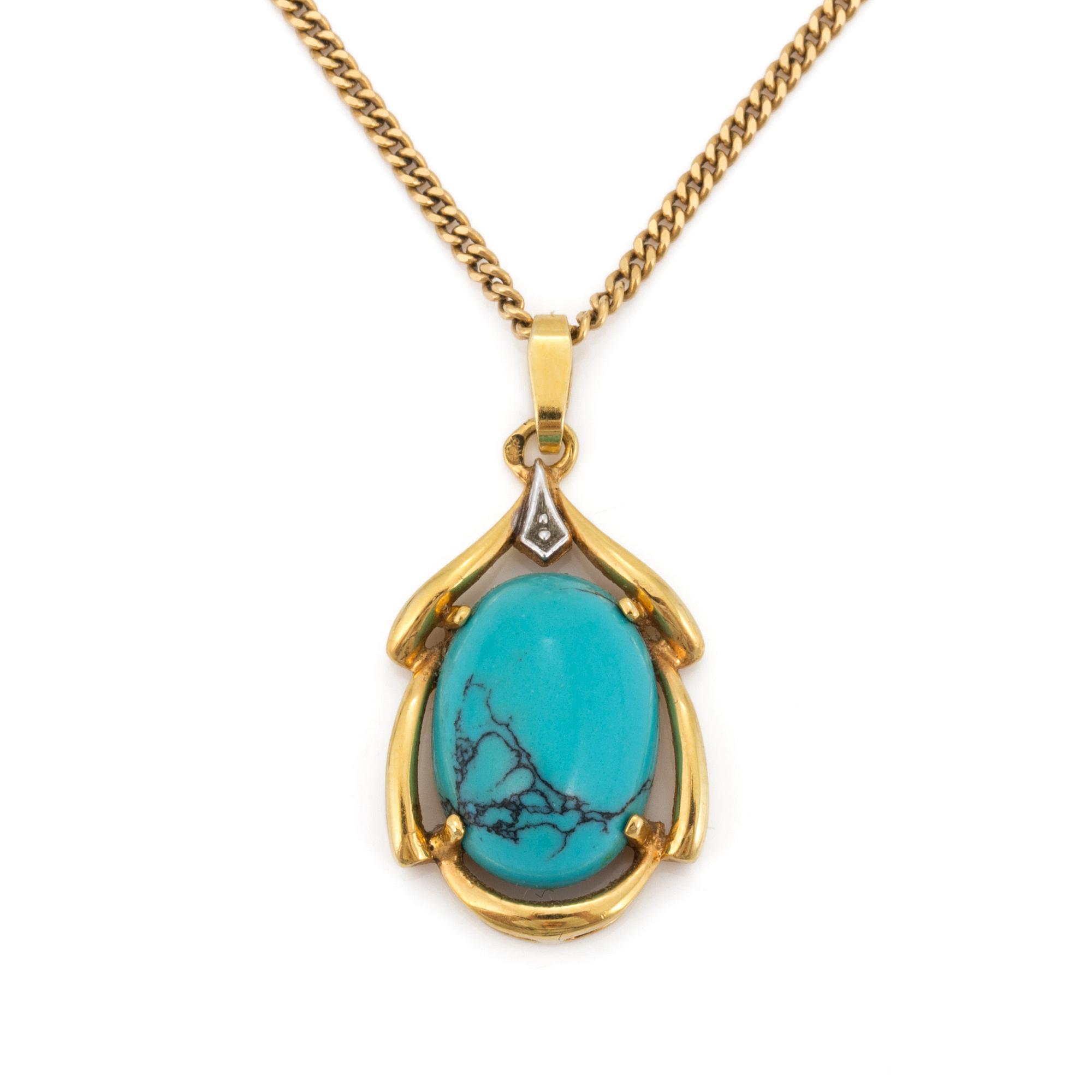 A 18K gold turquoise pendant.