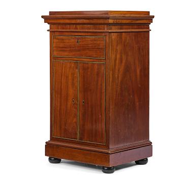 44. A late Gustavian mahogany column-cabinet, Stockholm, circa 1800.