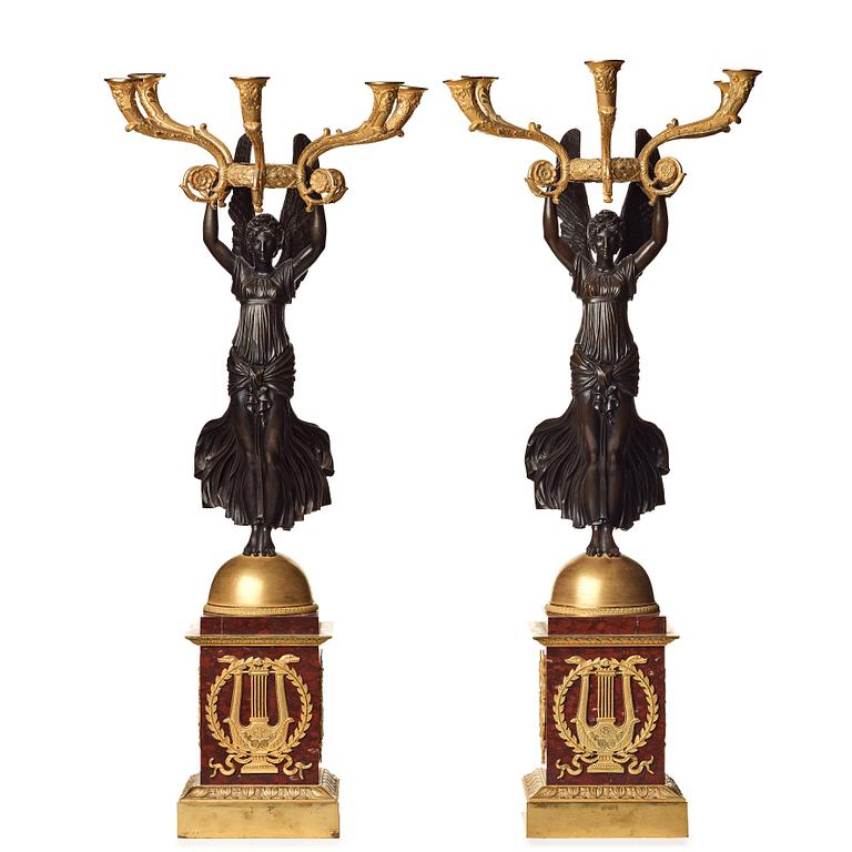 A pair of important five light Empire candelabra.