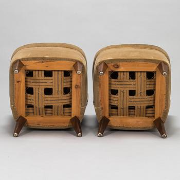 A pair of 1950s armchairs.