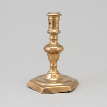 A 17th century bronze candlestick.