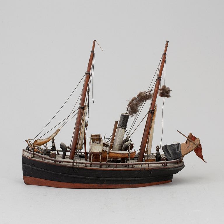 A 20th century wooden model of a steam engine boat.