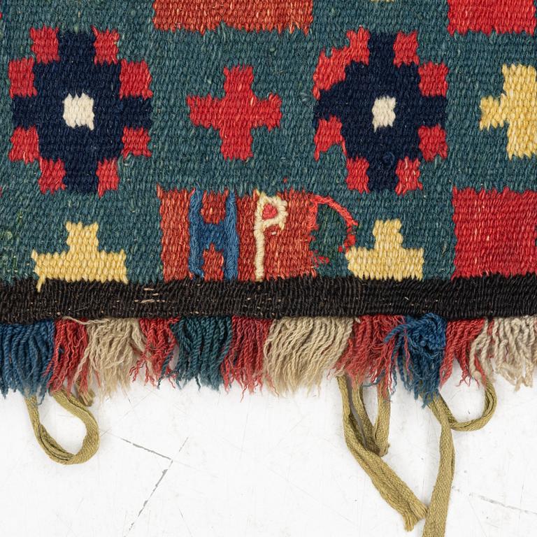 A carrige cushion,  'Genombruten stjärna', flat weave, c 99 x 56 cm, Vemmehög or Torna district, Scania, 1760-1800.