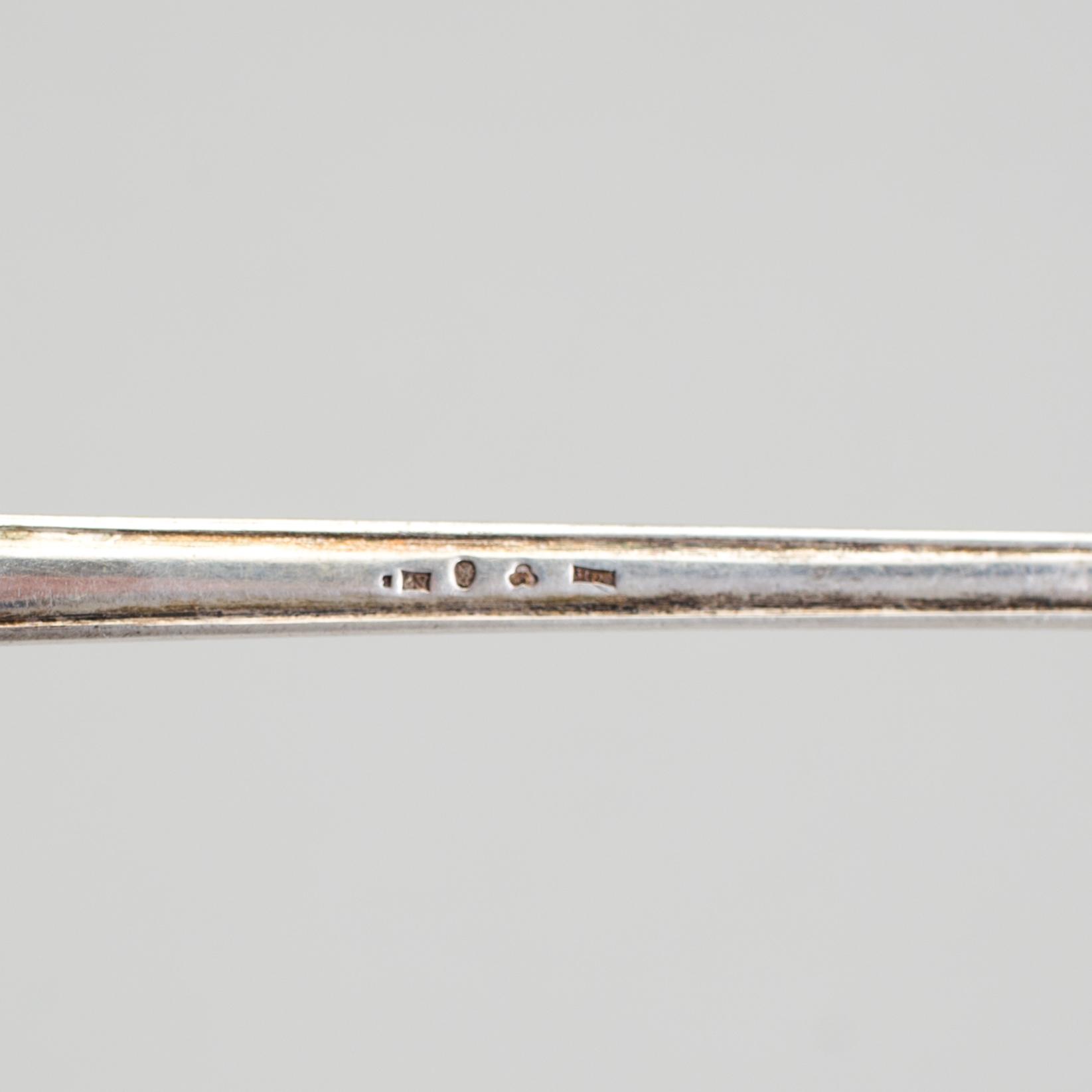 A Swedish early 20th century parcel-gilt soup-ladle, marked CGH, Stockholm 1907.