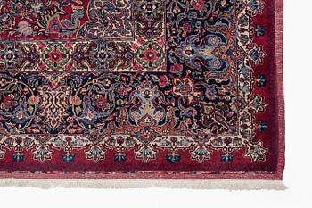 A Mashad carpet, signed Saber, c. 468 x 348 cm.