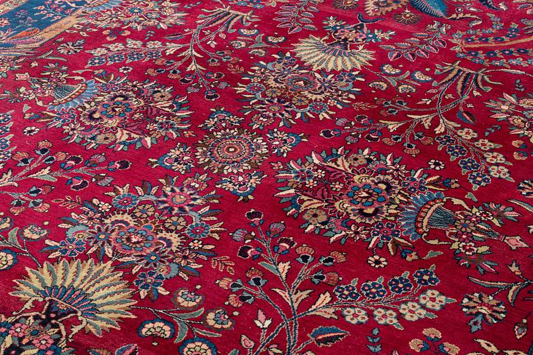 A semi-antique Mashad carpet, northeastern Persia, c. 404 x 307 cm.