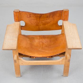 A Børge Mogensen oak and leather 'Spanish Chair' by Fredericia Stolefabrik, Denmark.