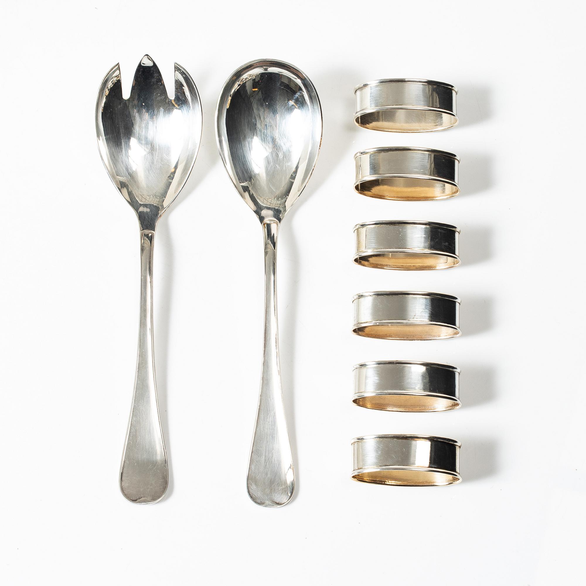 Salad servers, a pair, and six napkin rings, silver, second half of the 20th Century.