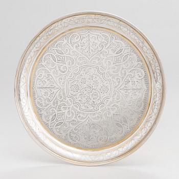 A parcel-gilt silver tray, Moscow 1856.