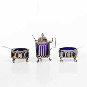Two silver salt cellars, and a mustard pot, French hallmarks, late 18th Century.