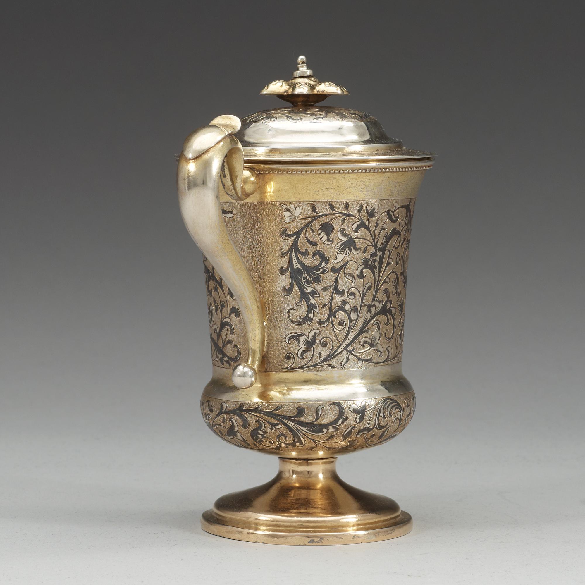 A Russian 19th century silver-gilt and niello cup and cover, unidentified makers mark, Moscow 1850.