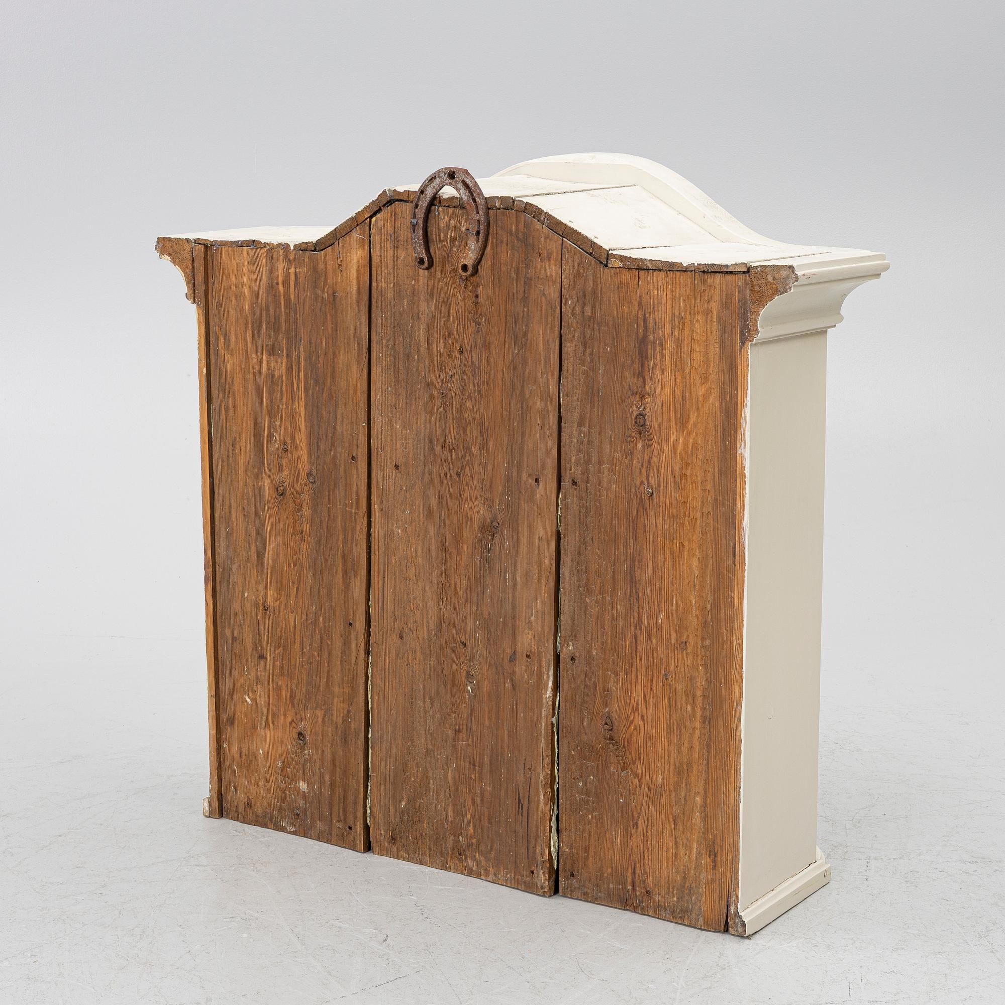 A Swedish rococo hanging cabinet, mid 18th century.