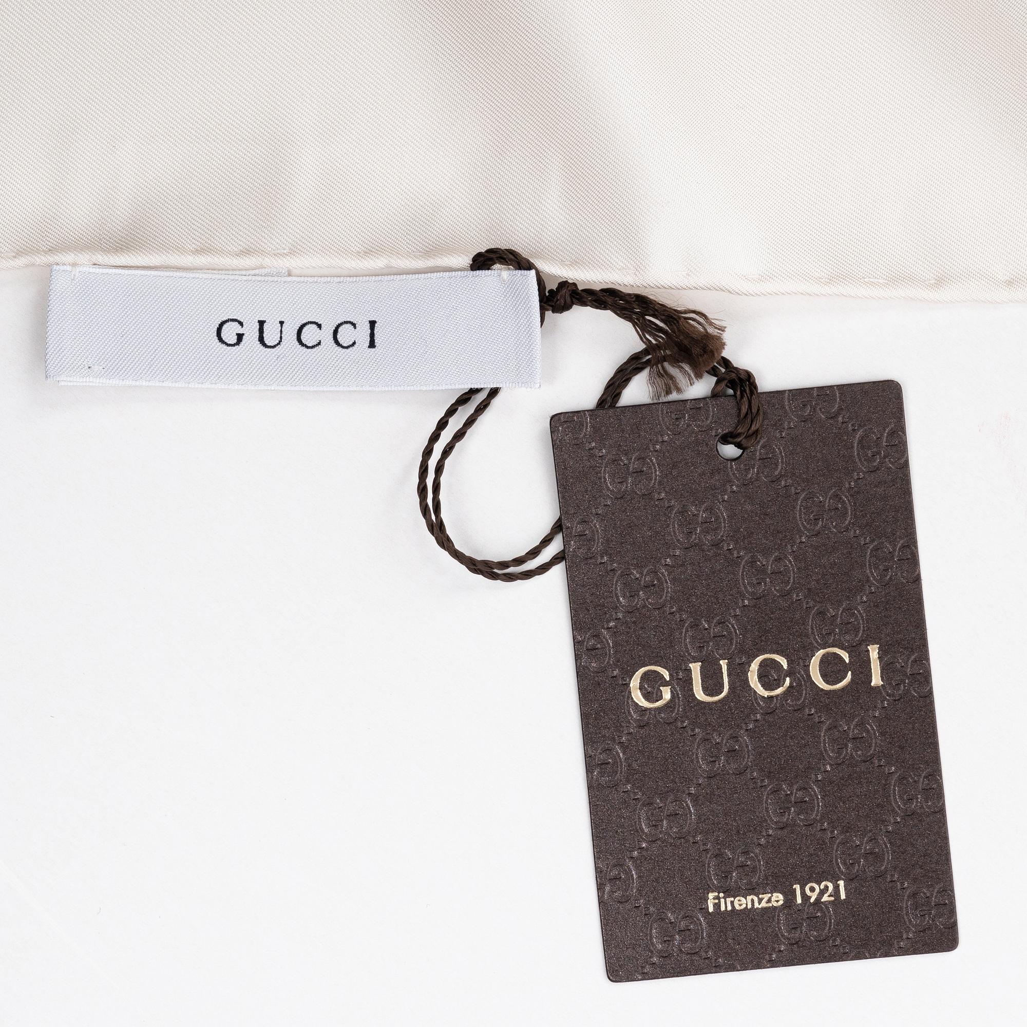Gucci, a 'Flora' twill silk scarf.