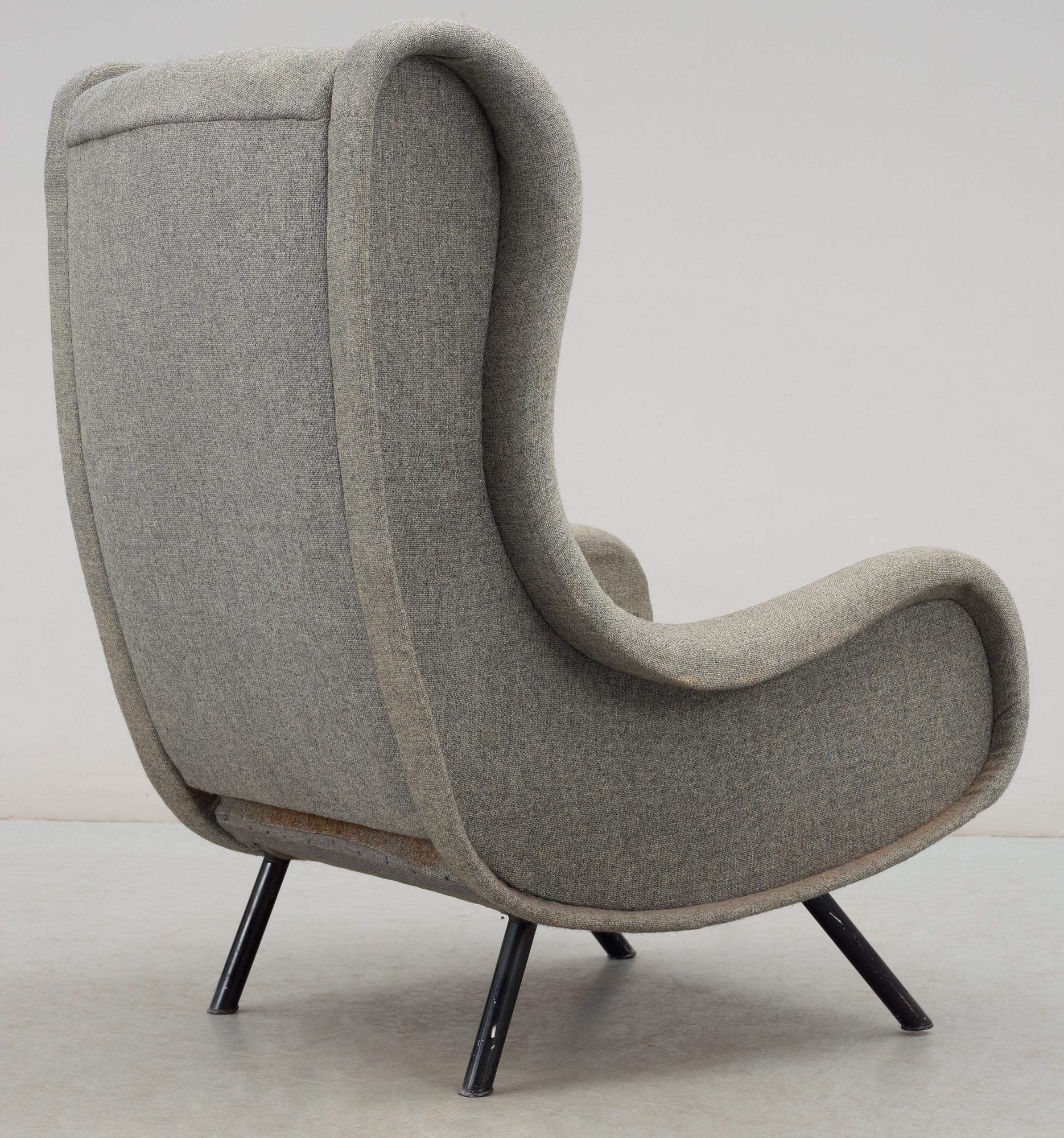 A Marco Zanuso 'Senior' lounge chair, upholstered in grey fabric, black lacquered metal legs, Italy.