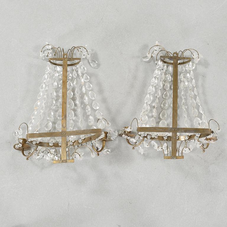 A pair of wall chandeliers from the first half of the 20th century.