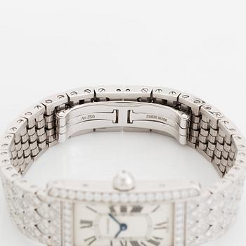 A Cartier "Tank Américane" 18K white gold watch set with round brilliant-cut diamonds.