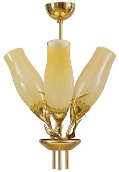 73. Paavo Tynell, PAAVO TYNELL (FINLAND), A PENDANT CEILING LAMP, brass, three yellow glass shades. Idman.