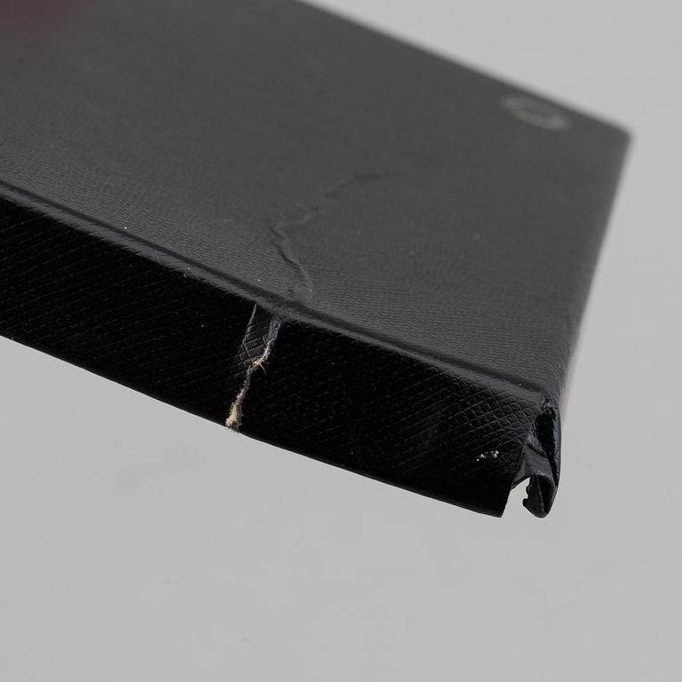 MOntblanc, a ball point pen and leather passport holder.
