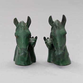 A pair of bronze bookends from the second half of the 20th century.