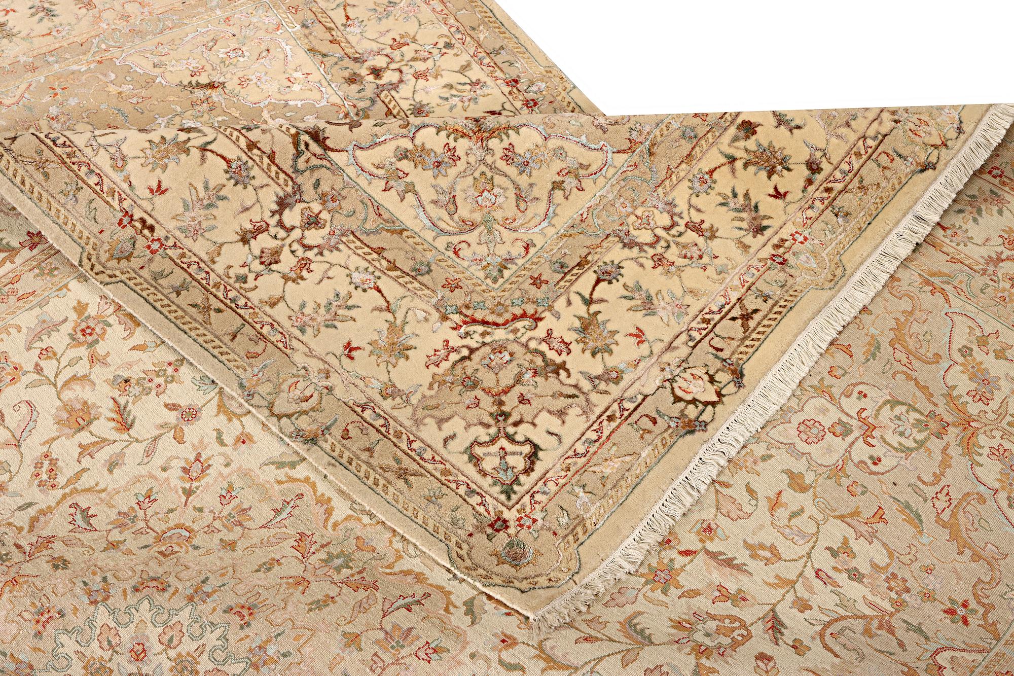 A Tabriz carpet, part silk, c. 311 x 199 cm.