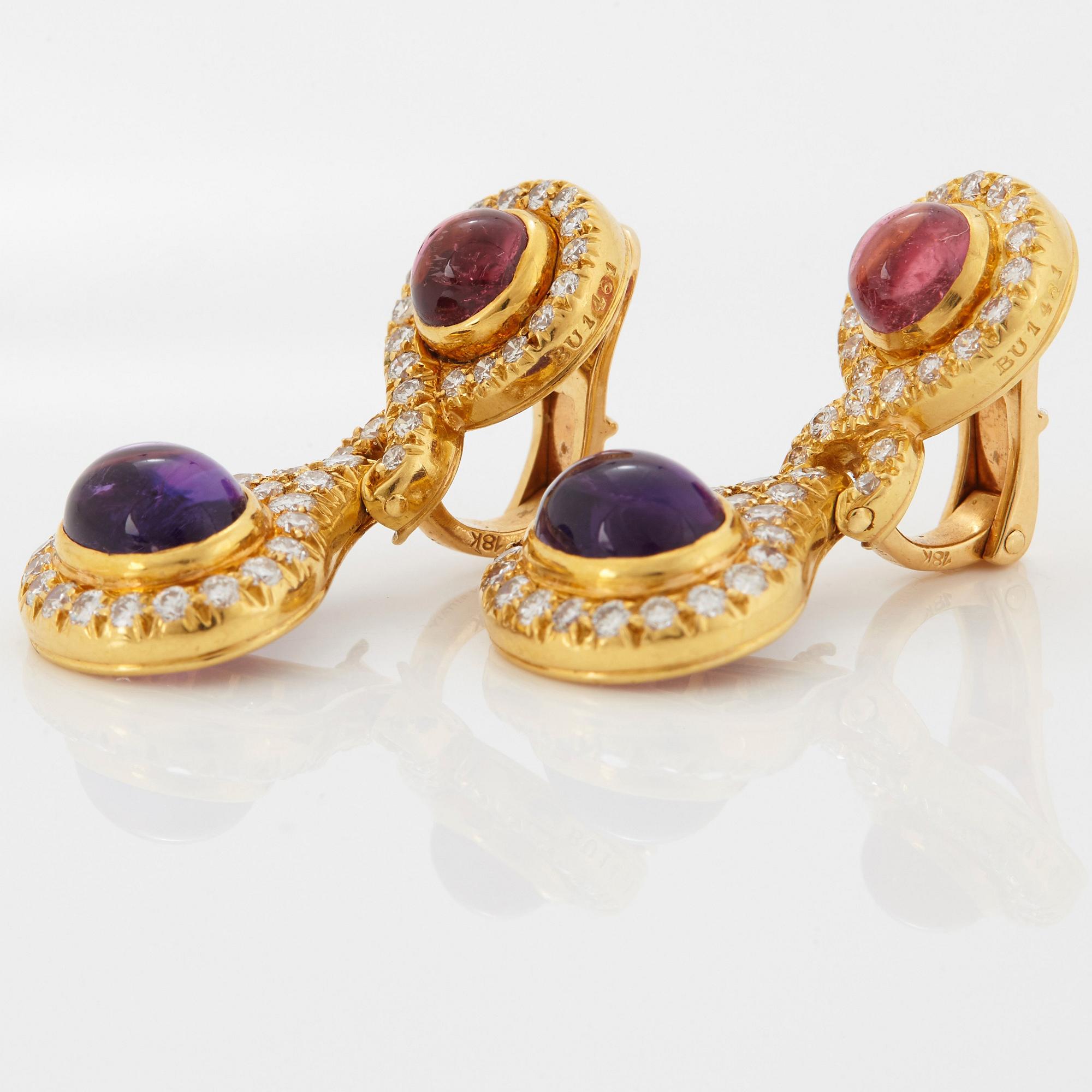 A pair of 18K gold Bulgari earrings set with cabochon-cut amethyst and tourmaline.