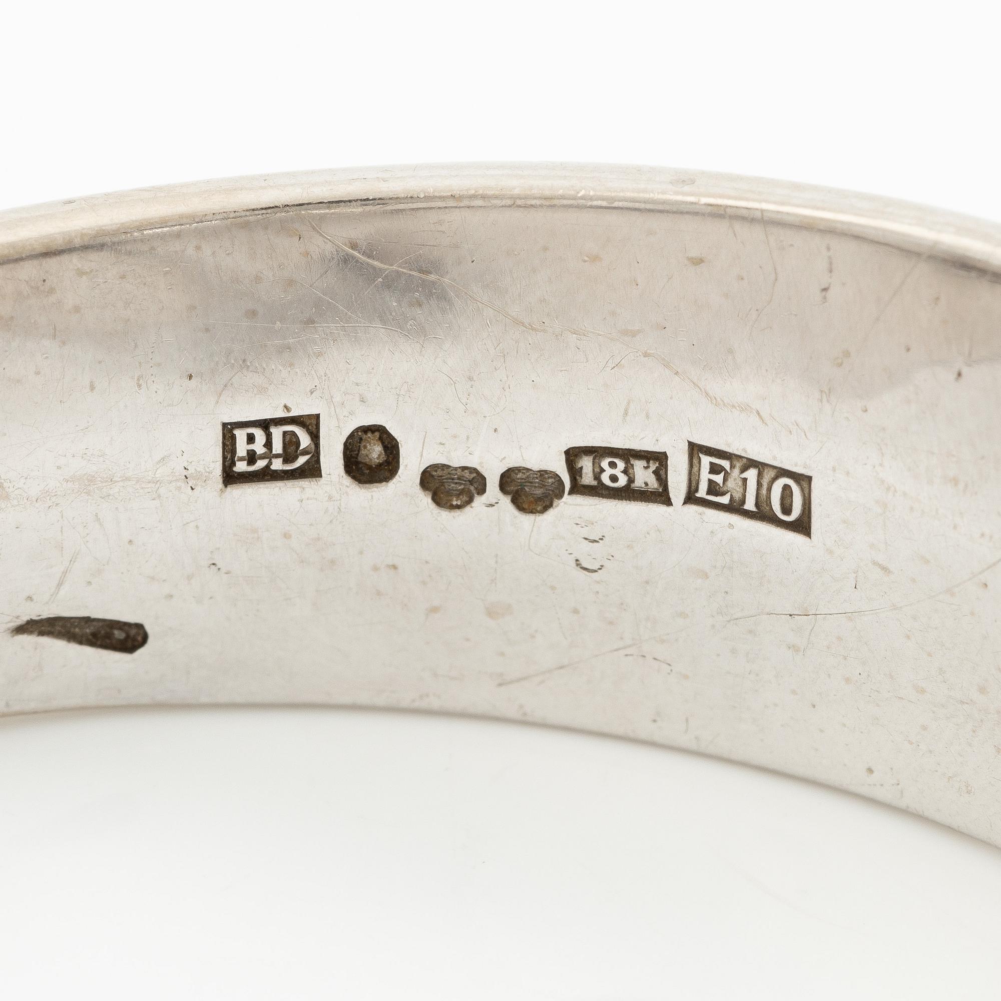 Aftonklocka/armring, Bo Dolk, 18K vitguld med briljantslipade diamanter, 1970-tal.