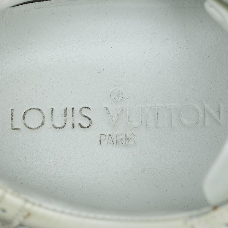 A pair of Louis Vuitton shoes.