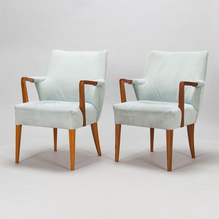 A set of ten 1950's open arm chairs for Oy Paul Boman Ab.