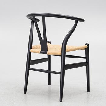 Hans J. Wegner, a model CH-24/'Wishbone' chair, Carl Hansen, Denmark, 21st century.