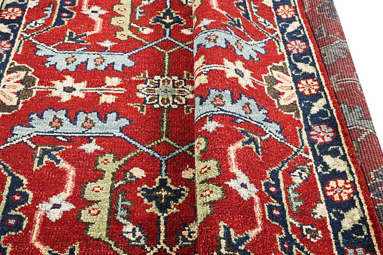 An oriental carpet, c. 301 x 239 cm.
