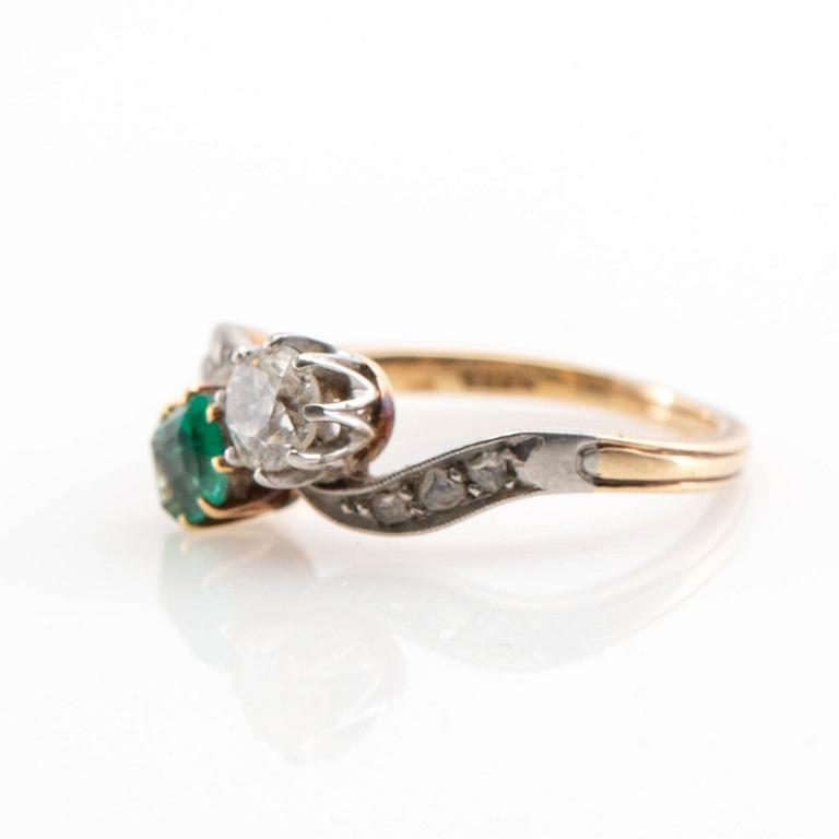 Ring, 14K gold with emerald and diamonds.