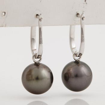 A pair of cultured Tahiti pearl and brilliant cut diamond earrings.
