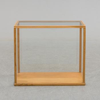 a mid 20th century oak and glass cabinet.