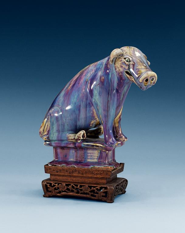A flambé-glazed porcelain figure of a pig, Qing dynasty, 18th/19th Century.