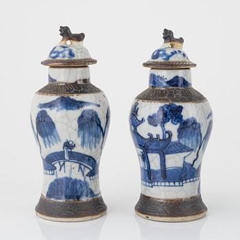 A group of four Chinese blue and white urns with cover, a jar and a flower pot. 19th and 20th century.