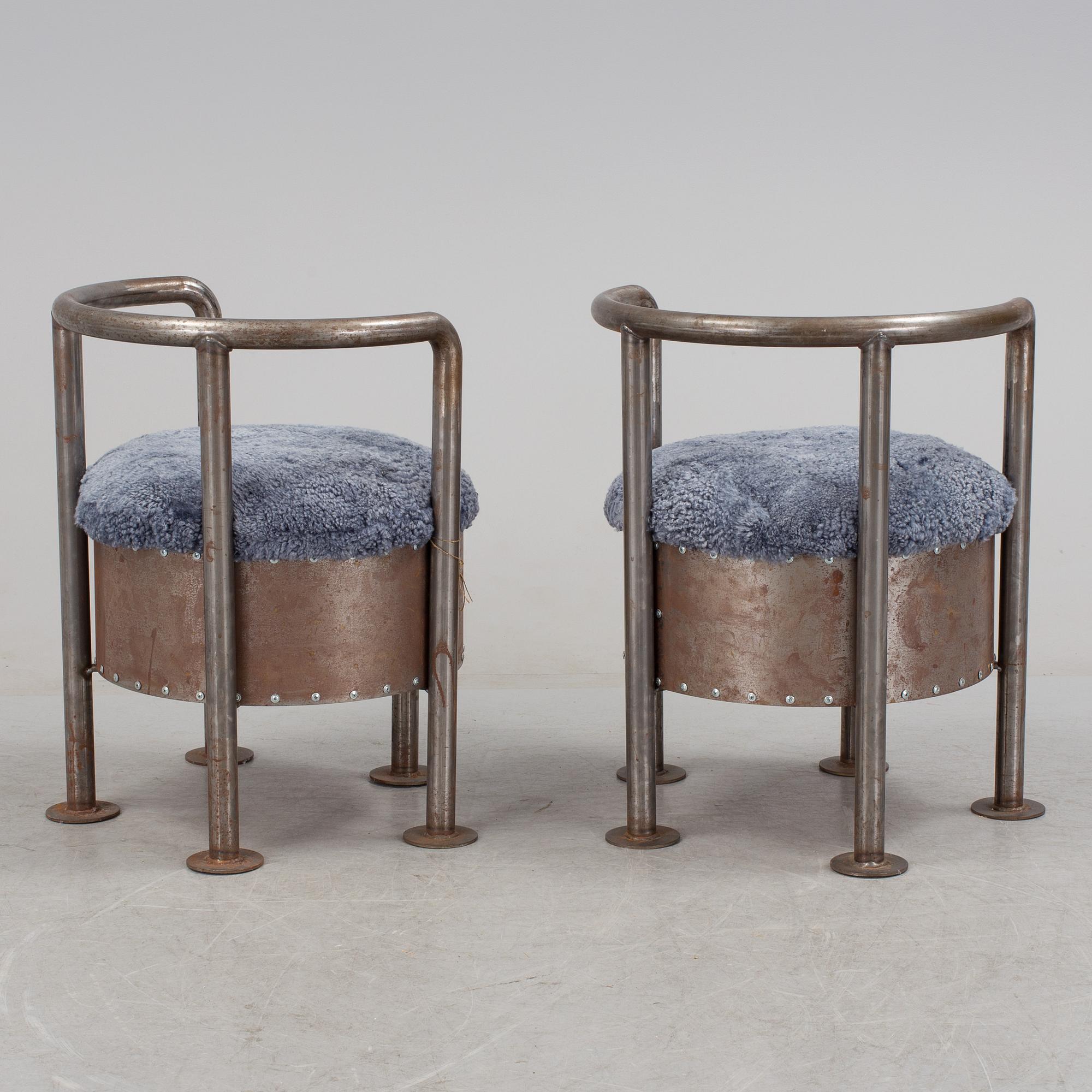 A pair of steel chairs by Arpad Földessy, 21st Century.