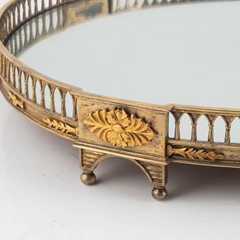 A Louis XVI-style mirrored gilt brass 'surtout de table', later part of the 19th century.