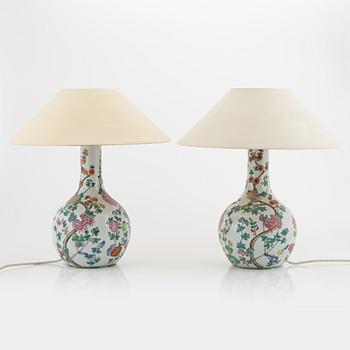 A pir of porcelain table lamps, 20th century.