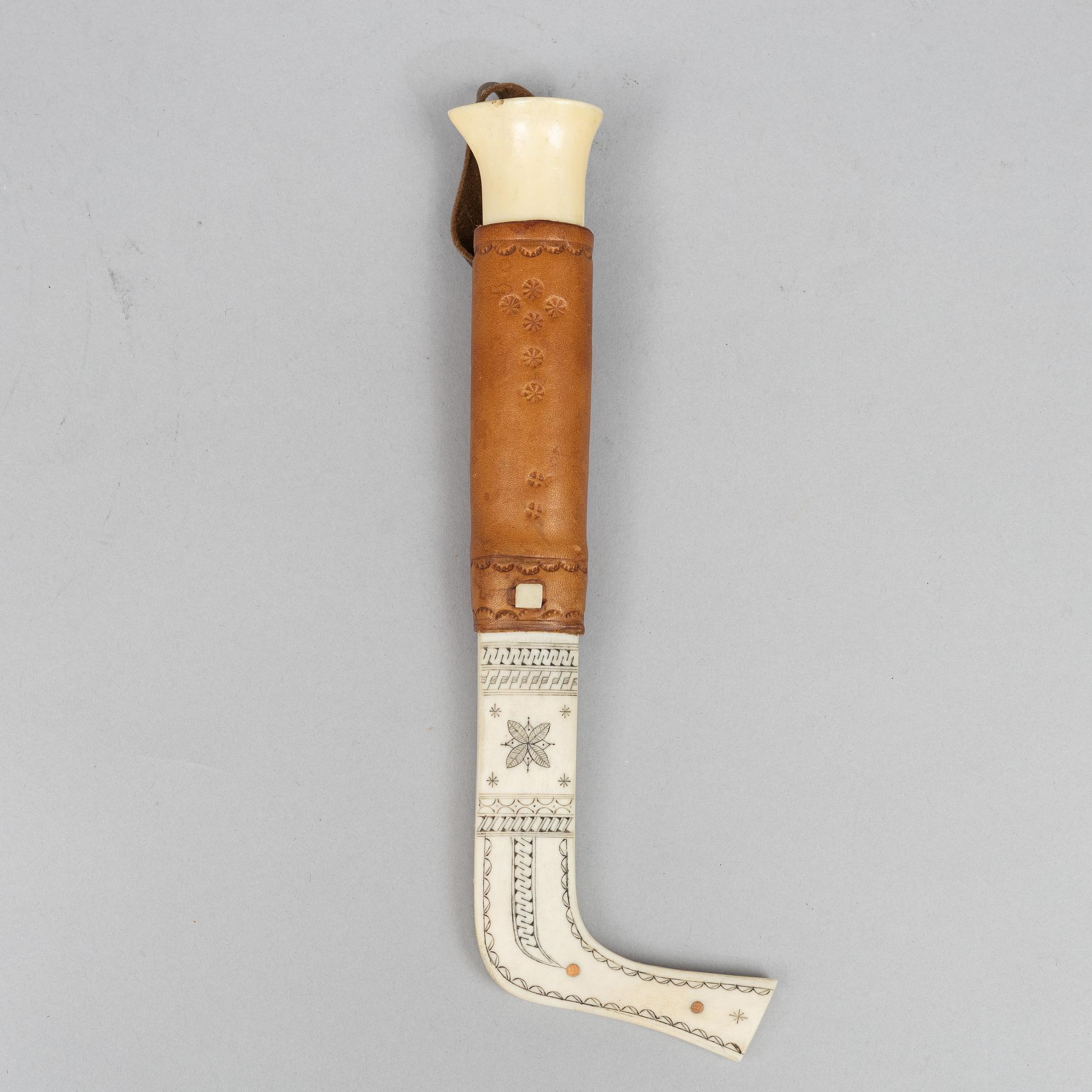 Oskar Tjäder, A reindeer horn knife, signed.