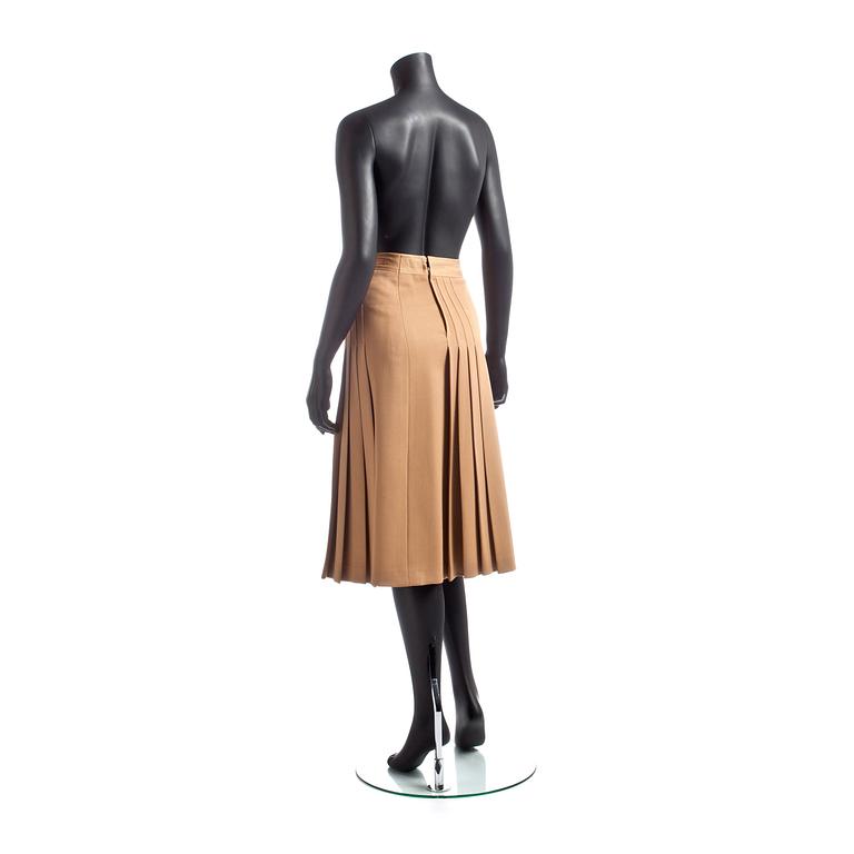 CÉLINE, a beige wool skirt.