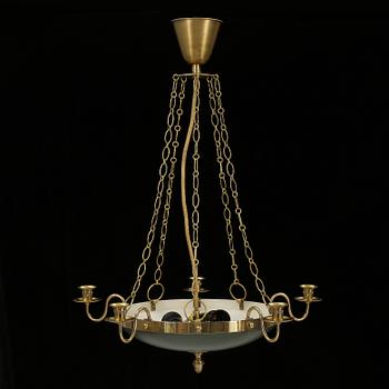 Empire · TAKAMPEL, empirestil, omkring 1900-talets mitt. Total höjd ca 68 cm.