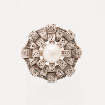A ring set with a cultured pearl and rose-cut diamonds.
