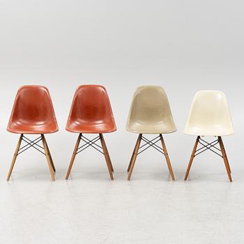 A set of four 'Plastic Chairs DSW' by Charles & Ray Eames for Herman Miller with new legs from Vitra.