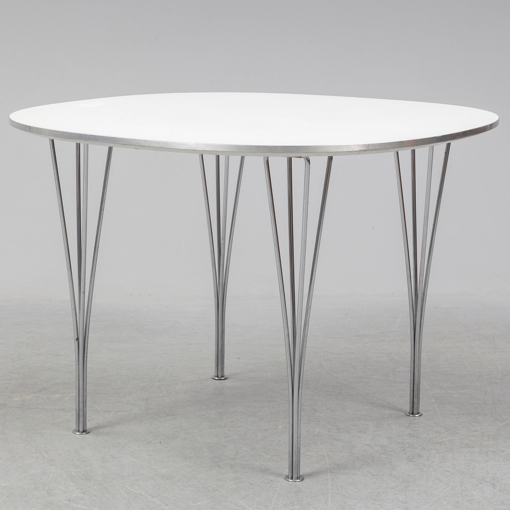 A table by Bruno Mathsson and Piet Hein for Fritz Hansen dated 1990.