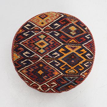 A Kelim covered stool.