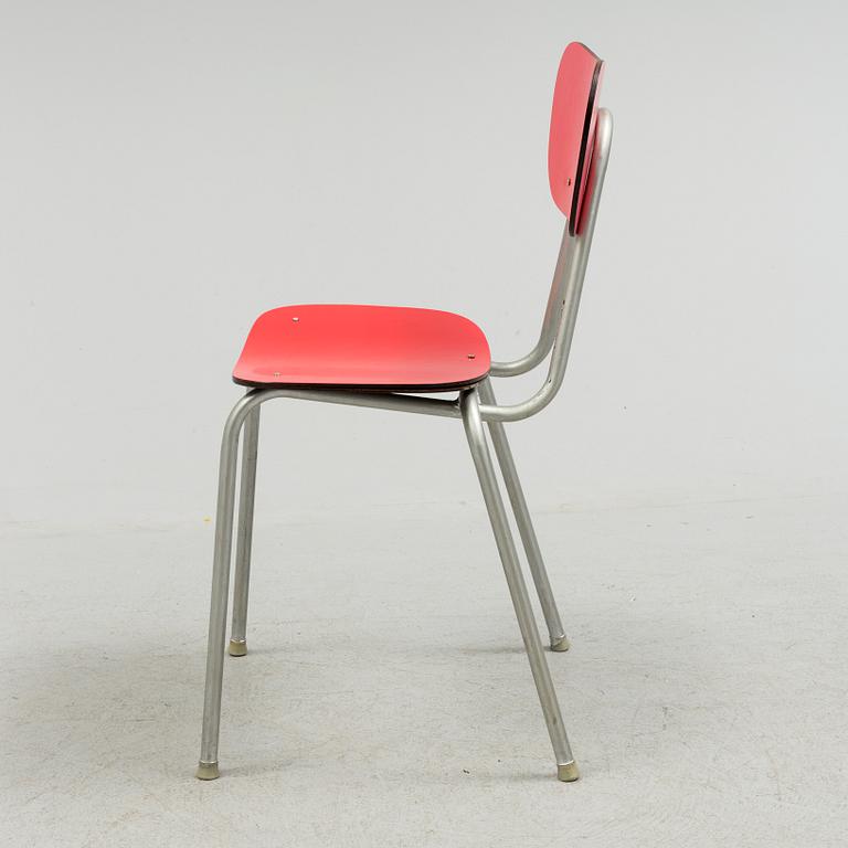 A mid 20th century table and chair.
